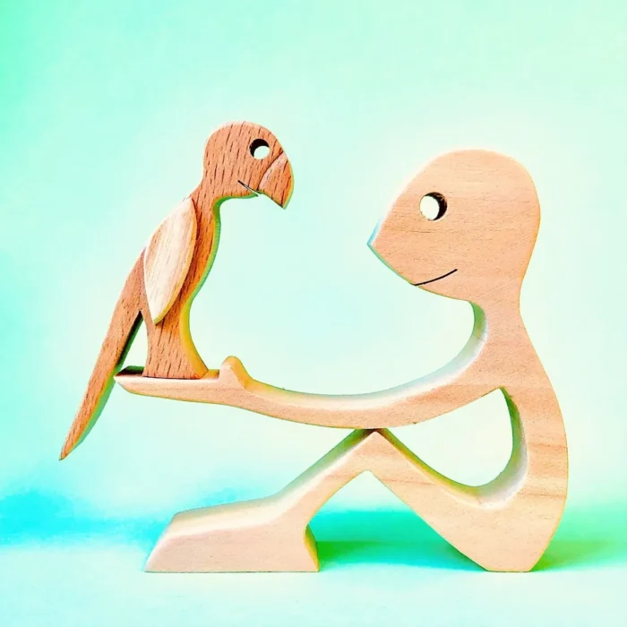 a man a parrot wood sculpture Handmade