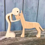 a man a great Dane handmade wooden sculpture