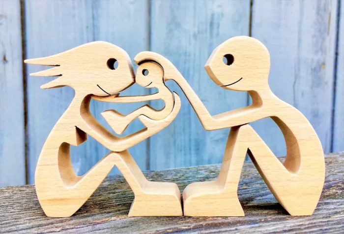 wood sculpture handmade a couple a child