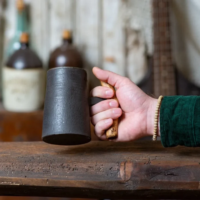 Dark rustic handmade ceramic mug with juniper wood